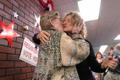 
Patty Duke, left, and singer Carole King exchange kisses after Duke introduced King at a voter registration rally at Long Ear record store in Coeur d'Alene on Thursday evening. King has been representing John Kerry on the campaign trail. 
 (Jesse Tinsley / The Spokesman-Review)