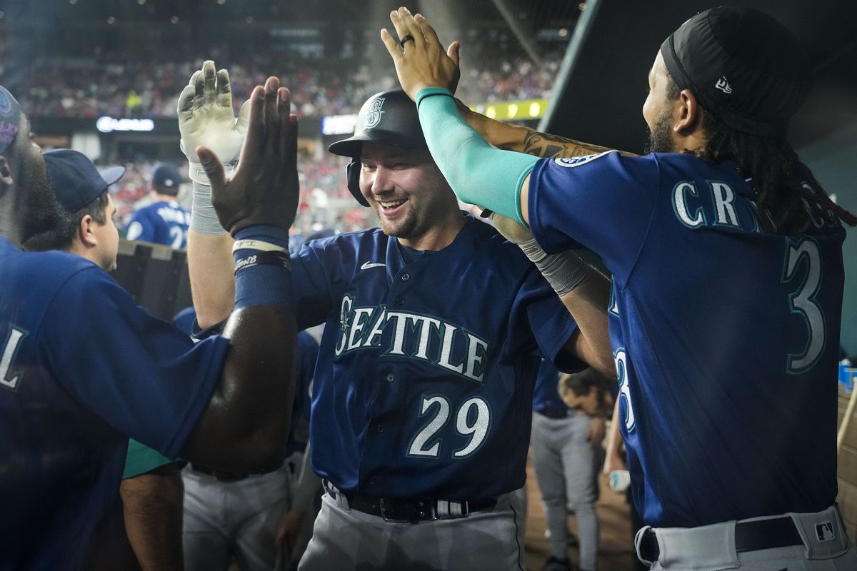 Seattle Mariners catcher Cal Raleigh (29) celebrates teammates after hitting a solo home run during the fifth inning against the Texas Rangers at Globe Life Field on June 3 in Arlington, Texas.  (Tribune News Service)