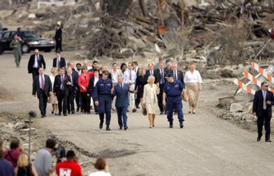 
Britain's Prince Charles and his wife Camilla, Duchess of Cornwall, in front center, talk with U.S. Coast Guard Vice Adm. Thad Allen and another official as the royal couple walk through the heavily damaged Ninth Ward in New Orleans on Friday. 
 (Associated Press / The Spokesman-Review)