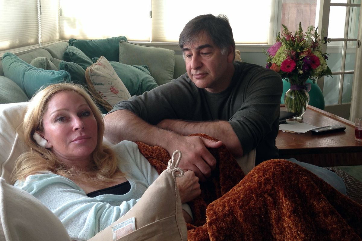 Debra Fine is seen here Sunday with her husband, Russell Fine, after being released from the hospital. (Associated Press)