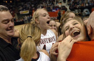 
Mossyrock's Tisa Pelletier, right, hugs coach Gary Stamper after the Vikings' State 2B title win. 
 (Ingrid Lindemann / The Spokesman-Review)