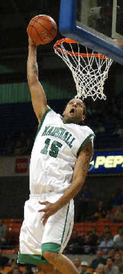 
Marshall's David Anderson dunks during the first half against Oregon, but it wasn't enough to stop the Ducks. 
 (Associated Press / The Spokesman-Review)