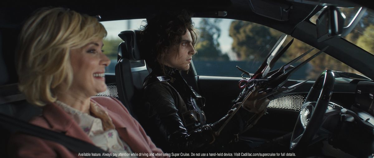 This photo provided by Cadillac shows a scene from the automaker’s 2021 Super Bowl ad, featuring actor Timothée Chalamet as Edward Scissorhands’ son.  (HONS)