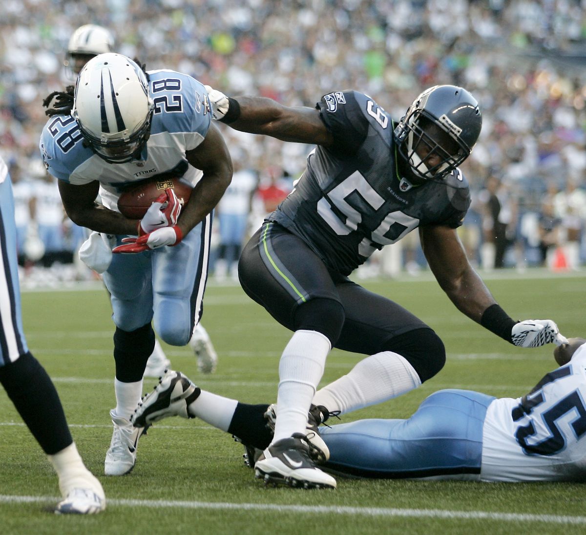 Aaron Curry and the rest of the Seahawks’ starting defense has yielded plenty of yards in the preseason, including this touchdown by Tennessee’s Chris Johnson. (Associated Press)