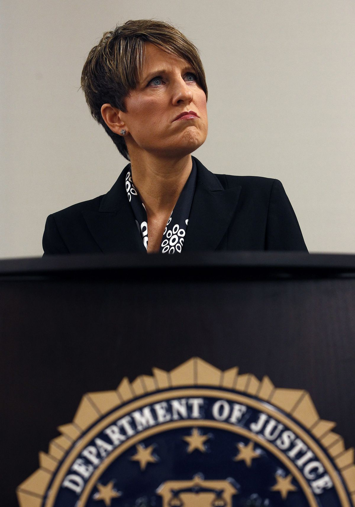 Laura E. Duffy, United States attorney for the southern district of California, pauses during a news briefing as she announces the indictment of suspects related to the death of U.S. Border Patrol agent Brian Terry. (Associated Press)