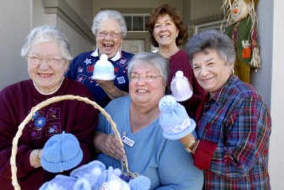 
Mad Hatters, clockwise from center front, Beverly Browne, Sharon Griffith, Willa Mae Griffith, Dorothy Selzler and Clara Leeds knit hats for infants at Kootenai Medical Center. 
 (File / The Spokesman-Review)