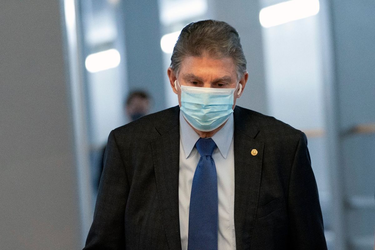 Sen. Joe Manchin, D-W.Va., walks to a vote in the Senate Chamber, Wednesday, Dec. 15, 2021, in Washington. (Jacquelyn Martin)