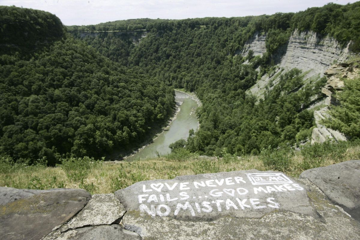 In this June 21, 2006, file photo, a message is seen painted on a rock wall overlooking Letchworth State Park in Castile, N.Y. (David Duprey / Associated Press)