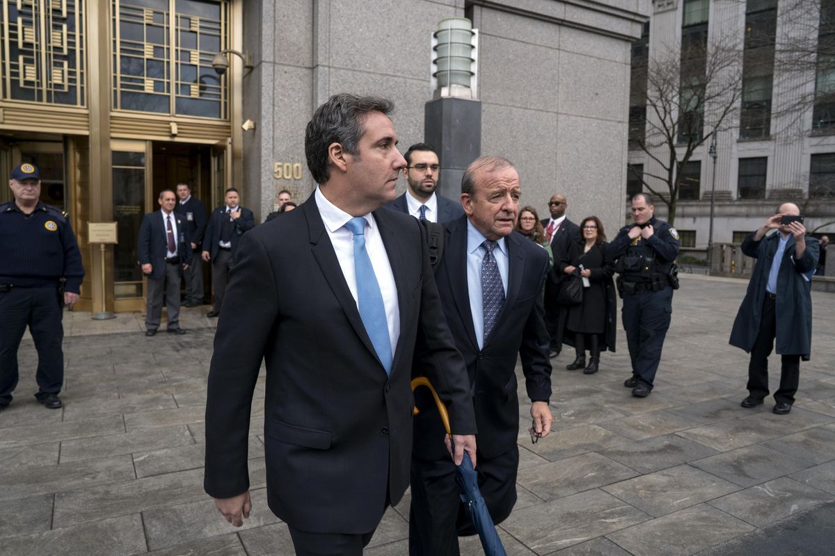Michael Cohen, President Donald Trump’s personal attorney, center left, leaves federal court following a hearing Monday, April 16, 2018, in New York. (Craig Ruttle / Associated Press)