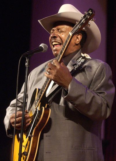 In this Feb. 13, 2005 photo, guitarist Lonnie Brooks performs with the Chicago Jazz Ensemble at the Simpson Theatre in the Field Museum in Chicago. Brooks, whose relationship with his adopted hometown was cemented by his hit recording of Robert Johnson's 