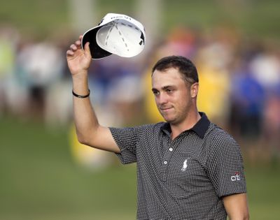 FILE - In this Jan. 15, 2017, file photo, Justin Thomas acknowledges to the gallery after winning the Sony Open golf tournament in Honolulu. Thomas is set to play in the Waste Management Phoenix Open this week, coming off a two-break after a dominating Hawaiian sweep. (AP Photo/Marco Garcia, File) ORG XMIT: NY167 (Marco Garcia / AP)