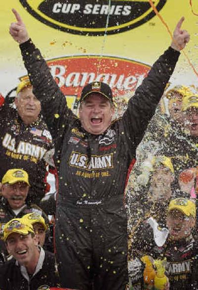 
Joe Nemechek celebrates with his crew after winning the Banquet 400. 
 (Associated Press / The Spokesman-Review)