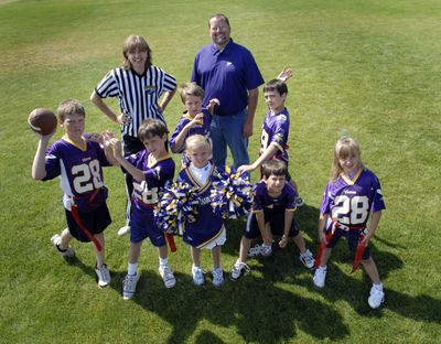 Upward flag football and cheerleading debuts this fall at Berean Bible Church. Director of football operations Jeff Miller and his wife, Pam, are heading the steering committee. Also pictured, clockwise from left, are, Payton Miller, 12; Aaron Miller, 9; Christian Miller, 9; Colton Poplawski, 11; Joliana Poplawski, 7; Kasey Miller, 7 and cheerleader Samantha Sennott, 8.bartr@spokesman.com (J. BART RAYNIAK / The Spokesman-Review)