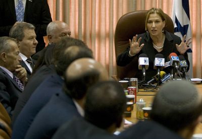 Israeli Foreign Minister Tzipi Livni, right, speaks during a faction meeting in  Jerusalem on Monday.  (Associated Press / The Spokesman-Review)