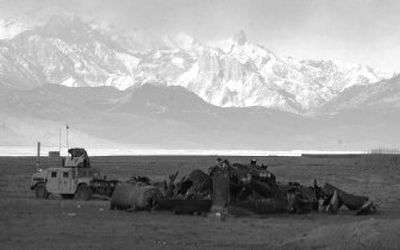 
A U.S. military Humvee guards the scene  where a U.S. helicopter crashed  in southeastern Afghanistan on Sunday after radioing in a  loss of power and engine failure. 
 (Associated Press / The Spokesman-Review)