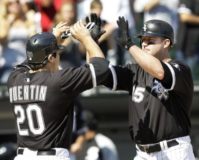 Jim Thome celebrates the first of four consecutive homers with Carlos Quentin.  (Associated Press / The Spokesman-Review)