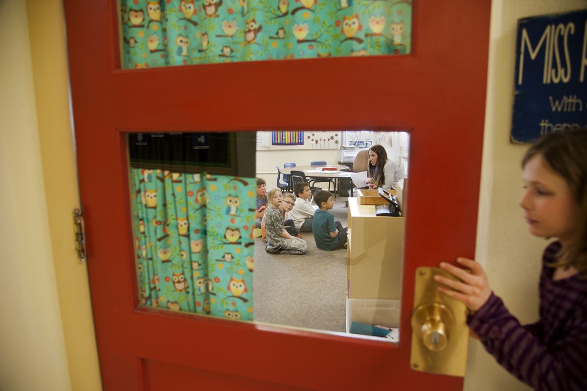 Rachel Roberts works with her second- and third-grade students in her classroom March 12 at Harrington School in Harrington, Wash. (Dan Pelle)