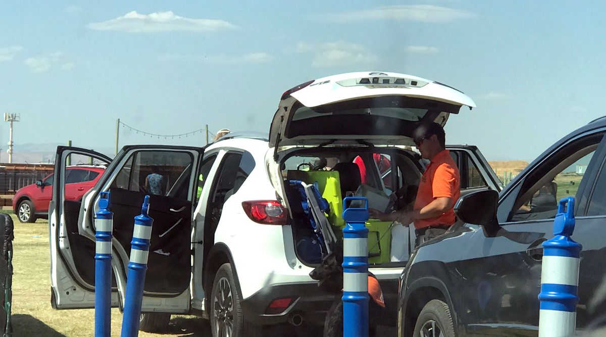 Venue security searches cars lined up to camp on July 29 at the Gorge Ampitheatre for a Boygenius show.  (Jonathan Brunt /The Spokesman-Review)