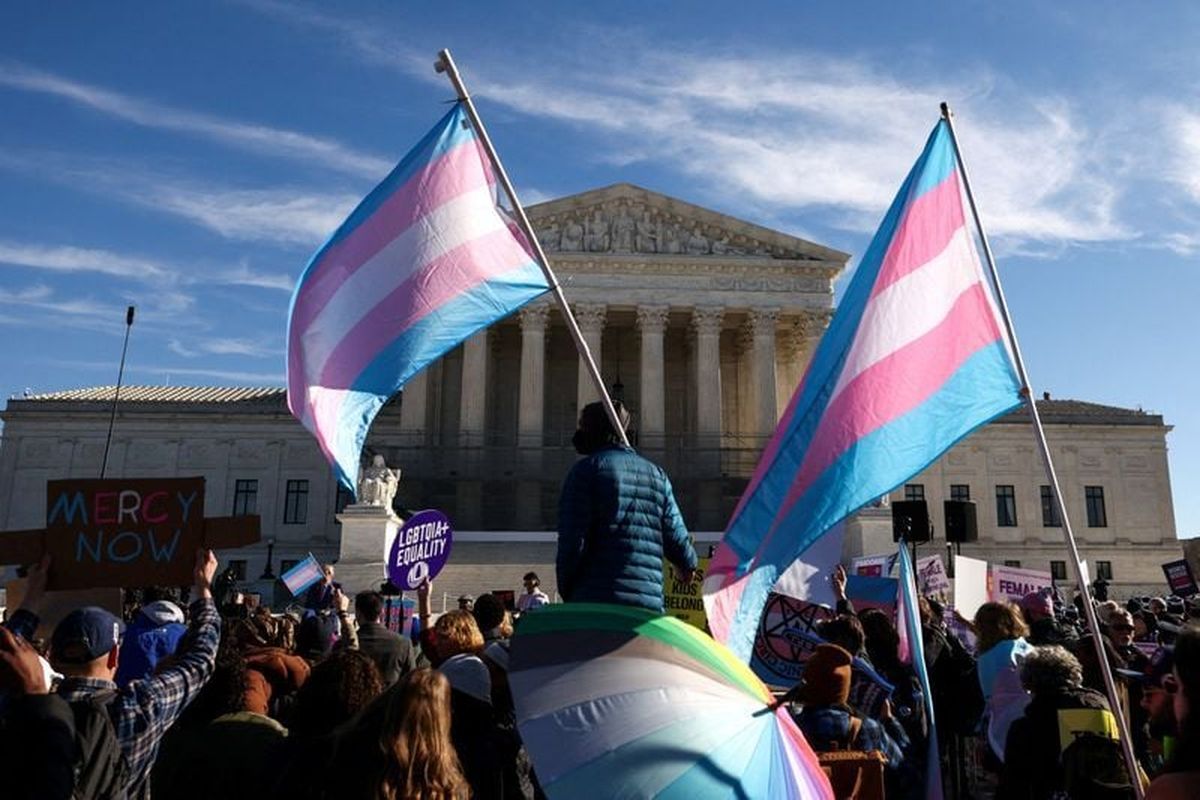 Demonstrators carry a transgender flags outside the U.S. Supreme Court, on the day the justices heard oral arguments in two cases concerning efforts to enforce Republican-backed state laws banning transgender athletes from female sports teams at public schools on Jan. 13, in Washington, D.C.  (Reuters )