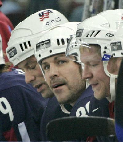 
Doug Weight, center, and Team USA still believe they can get untracked.
 (Associated Press / The Spokesman-Review)