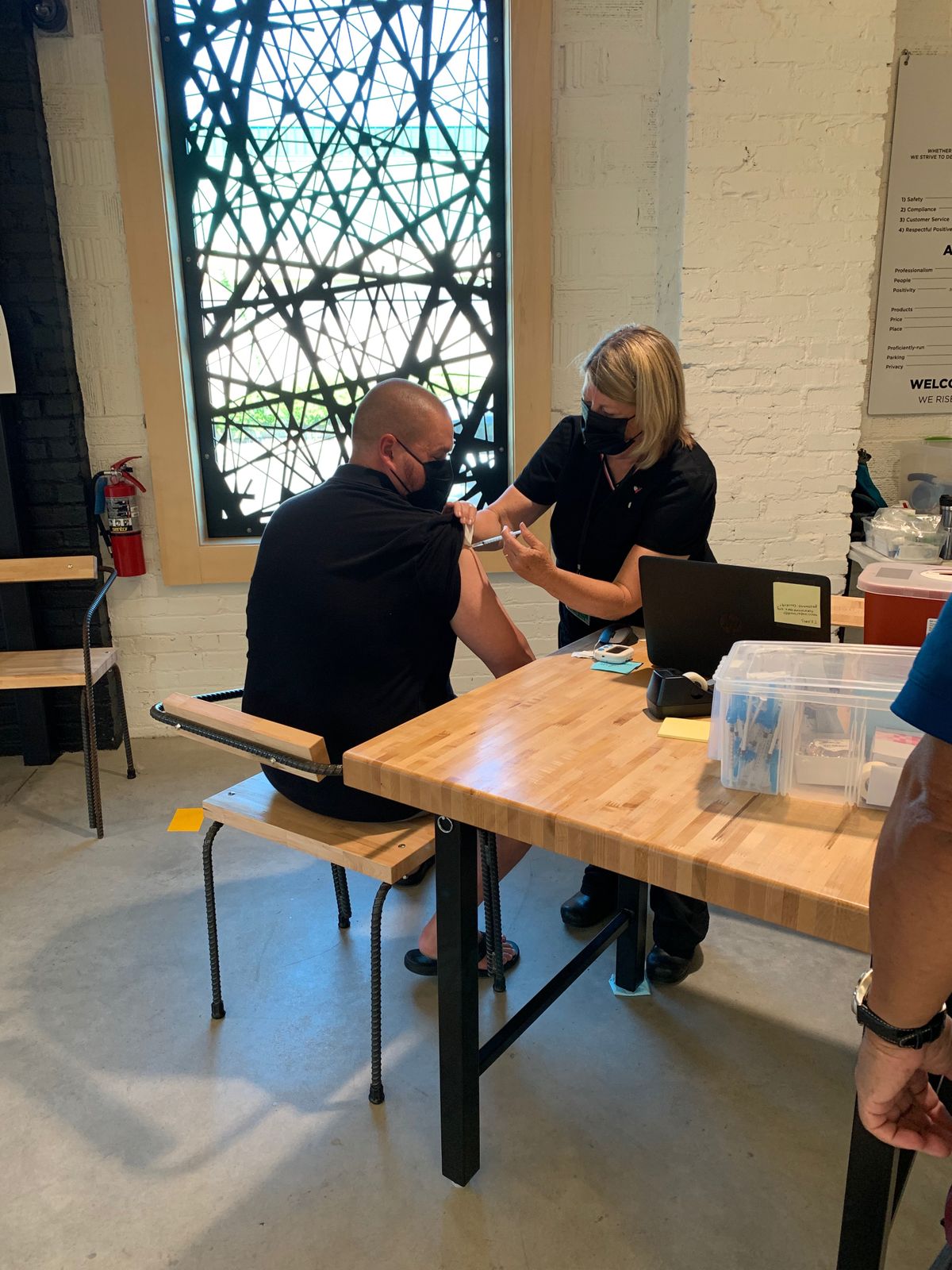 Robin, a representative from health care provider Consistent Care, provided COVID-19 vaccinations at Apex Cannabis as part of the Joints for Jabs program.  (Courtesy Apex Cannabis)