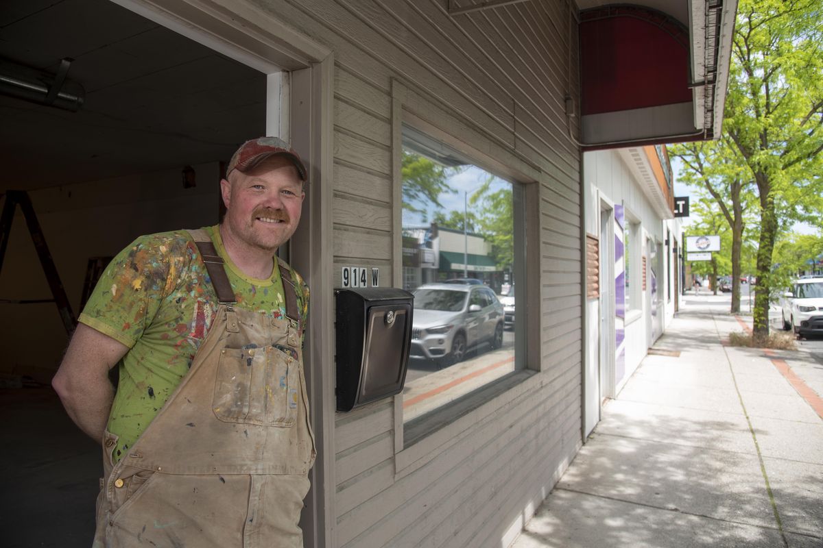 Artist Chris Bovey, known for nostalgia-themed posters, stands in the doorway of a former law office at 914 W. Garland Avenue, where he plans to open a retail store and studio.  (Jesse Tinsley/THE SPOKESMAN-REVI)