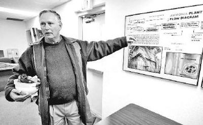 
Plant manager Clyde Knox explains an ammonia plant flow diagram at the Terra Industries Inc. plant in Port Neal, Iowa. An increase in demand has pushed manufacturers to crank out fertilizer at near capacity. 
 (The Spokesman-Review)