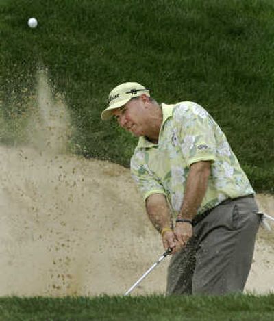 
Duffy Waldorf blasts out of a bunker Thursday at the John Deere Classic.Associated Press
 (Associated Press / The Spokesman-Review)