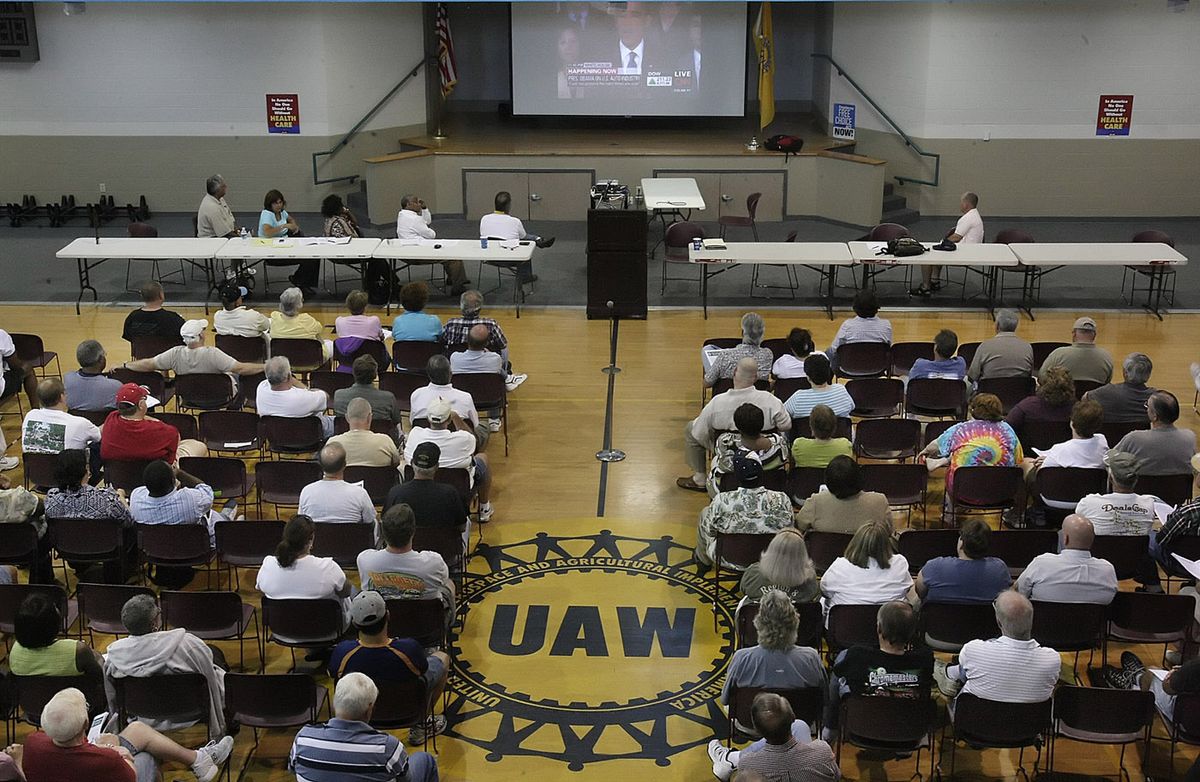 Retired United Auto Workers members watch President Barack Obama’s message at the union hall in Spring Hill, Tenn., on Monday. GM announced Monday that the Spring Hill assembly plant will be idled and production of  the Chevrolet Traverse will move to Lansing, Mich.  (Associated Press / The Spokesman-Review)