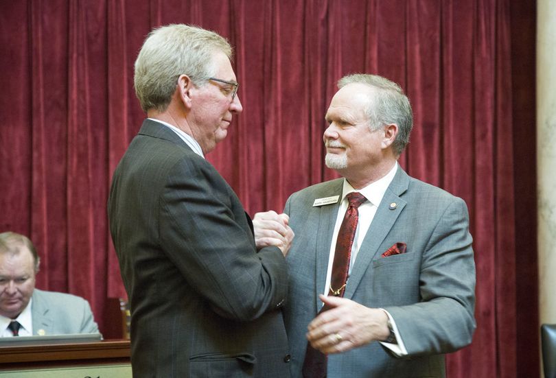 An emotional Sen. Bob Nonini, R-Coeur d'Alene, left, and Sen. Marv Hegedorn, R-Meridian, say their farewells as the Idaho Senate adjourns. Both are not returning next year because they are both candidates for lieutenant governor. The Idaho Legislature adjourned late Wednesday, March 28, 2018. (AP/Idaho Statesman / Katherine Jones)