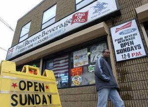 
 A pedestrian walks past Paul Revere Beverage on Sunday, Jan. 4, in Somerville, Mass. Liquor store owners in Massachusetts communities that have enacted the legal change have the option of staying open Sundays to sell alcoholic beverages .
 (File/Associated Press / The Spokesman-Review)