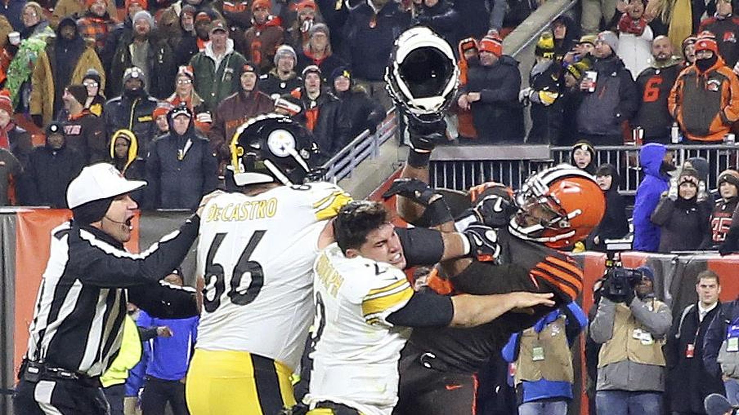 Myles Garrett strikes Mason Rudolph in the head with a helmet