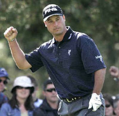 
Chris Di Marco pumps his fist after making a birdie chip on the 14th hole during his semifinal victory over Retief Goosen Saturday.
 (Associated Press / The Spokesman-Review)