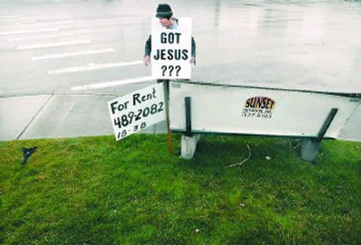 
Above: Lloyd Baggarley greets motorists recently at the corner of Trent Avenue and Argonne Road in Spokane Valley. 
 (Brian Plonka,the Spokesman-Review / The Spokesman-Review)