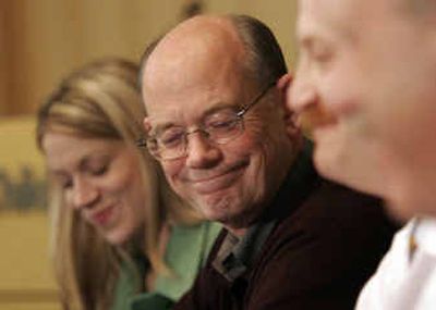 
Todd Hatch, center, father of Laura Hatch, and Amy Hatch, left, smile as Laura's doctors describe her recovery during a news conference at Children's Hospital in Seattle on Monday. Laura spent eight days trapped in a car without food or water in early October. 
 (Associated Press / The Spokesman-Review)