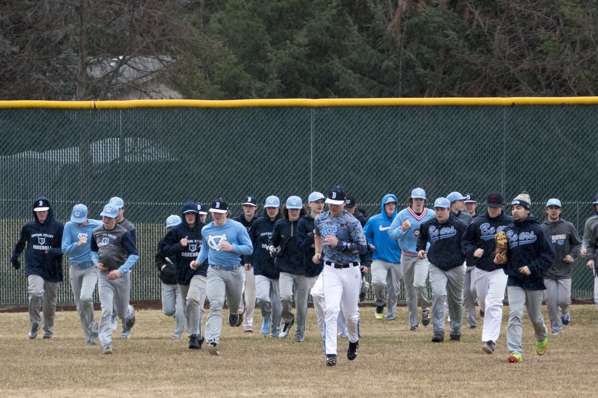 Last year’s Central Valley Bears baseball team warms up in the rain on March 2107. This year’s Bears will play Chiawana in the District 8 tournament Thursday, May 3, 2018, in Pasco. (Jesse Tinsley / The Spokesman-Review)