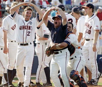 The Cavaliers celebrate their 5-1 victory over Mississippi that earned them a trip to the College World Series. (Associated Press / The Spokesman-Review)