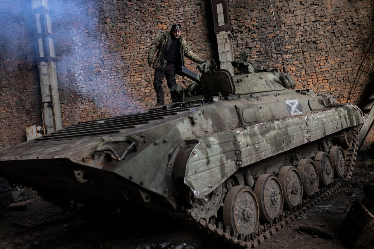 At a field repair site in the Kharkiv region, a maintenance battalion works to repair tanks and armored personnel carriers seized from the Russians, along with some Ukrainian ones.  (Heidi Levine/For The Washington Post)