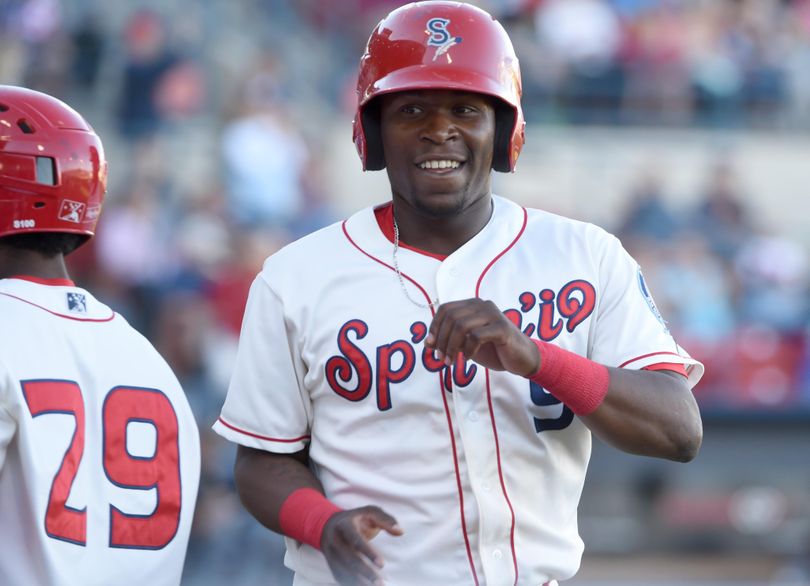 Spokane’s Xavier Turner comes home to score with a smile on his face in the second inning at Avista Stadium on Monday. (Jesse Tinsley / The Spokesman-Review)