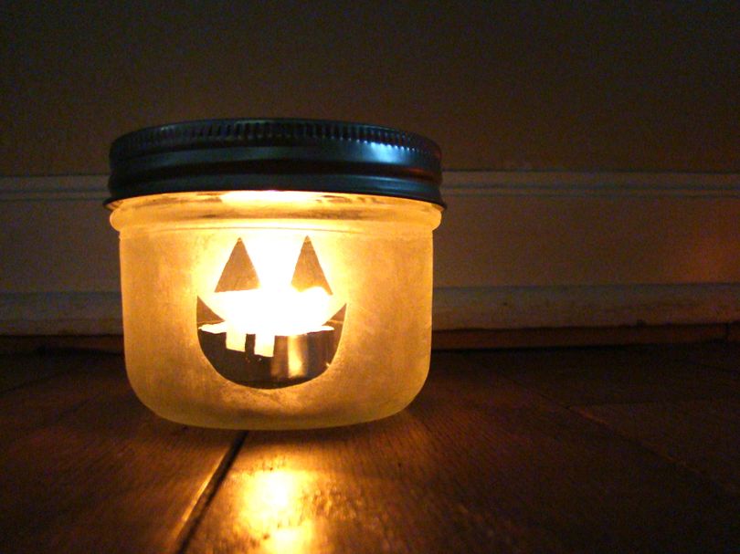 A simple mason jar can be transformed into a Halloween candle with a little glass etching. (Maggie Bullock)