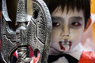 
Dressing up in costumes is one of the best parts about Halloween, according to children polled in a survey about the annual fright fest.
 (File Associated Press / The Spokesman-Review)