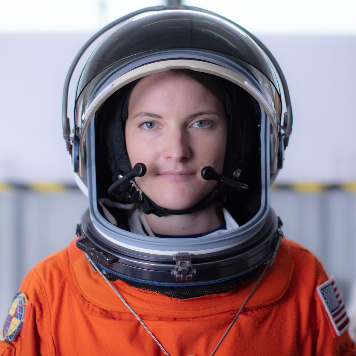 Kayla Barron poses for a portrait after donning her spacesuit at NASA