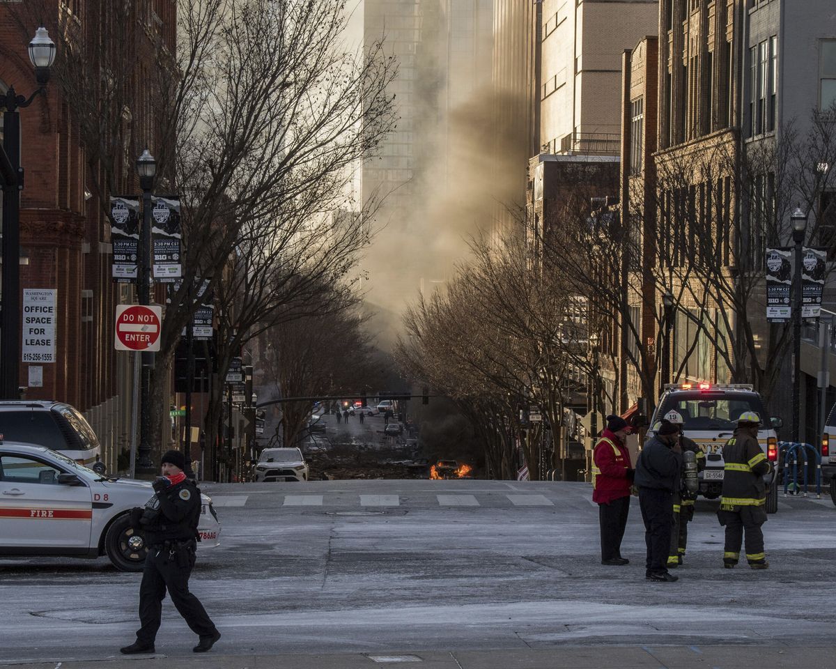 A vehicle is on fire after an explosion in the area of Second and Commerce Friday, Dec. 25, 2020 in Nashville, Tenn. Buildings shook in the immediate area and beyond after a loud boom was heard early Christmas morning.  (MBR/Associated Press)