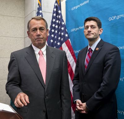 House Speaker John Boehner of Ohio, left, joined by Rep. Paul Ryan, R-Wis., takes reporters’ questions on Capitol Hill in Washington on Wednesday. (Associated Press)
