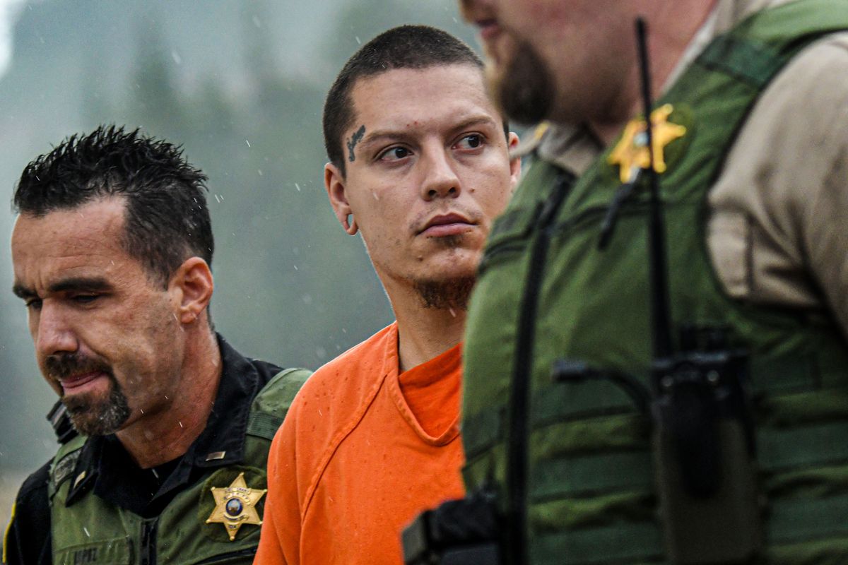 Majorjon Kaylor is escorted across the street to jail from the Shoshone County Courthouse after his first appearance on Tuesday in connection with the shooting on Sunday that killed four people.  (KATHY PLONKA/THE SPOKESMAN-REVIE)