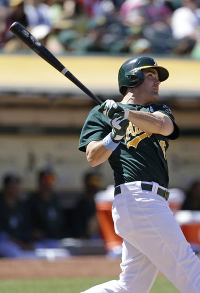 Seth Smith’s home run blew the game open in the seventh inning for the A’s. (Associated Press)