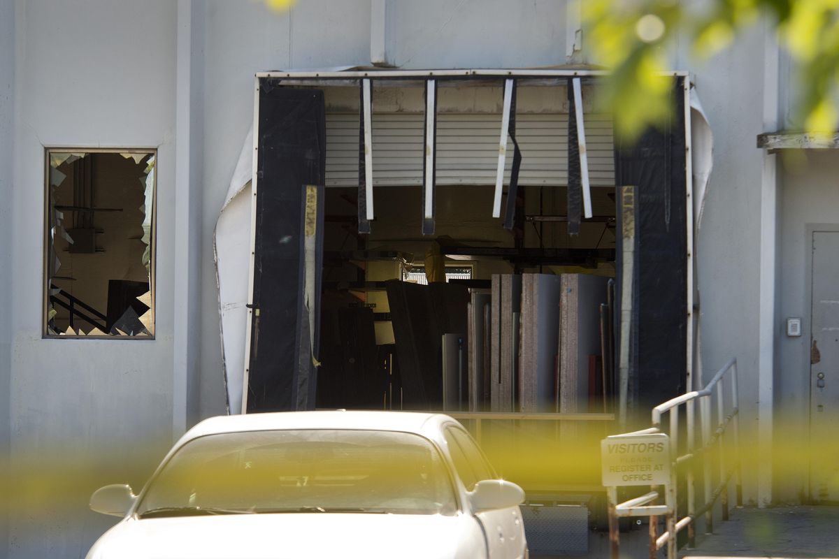 An explosion shattered windows and damaged loading dock, Tuesday night at the Zodiac Aerospace plant in Newport, Wash. (Dan Pelle / The Spokesman-Review)