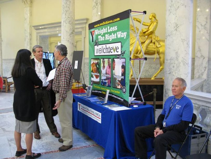 The YMCA offers displays in the fourth-floor rotunda of the state Capitol on Thursday, highlighting everything from sports and weight-loss to children's programs and programs for cancer survivors (Betsy Russell)