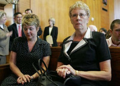 
Carol Ernst, right, and her daughter Shawna Sherrill, left, sit in the courtroom waiting for the trial to begin Thursday in Angleton, Texas. Ernst's case against Vioxx maker Merck Co. is the first of more than 3,800 suits to go to trial. 
 (Associated Press / The Spokesman-Review)