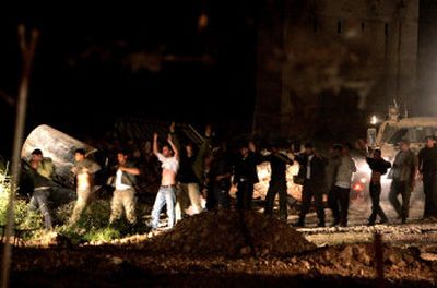 
Palestinian prisoners line up in front of Israeli soldiers as they are marched out of the prison at the end of a standoff in the West Bank town of Jericho on Tuesday. 
 (Associated Press / The Spokesman-Review)